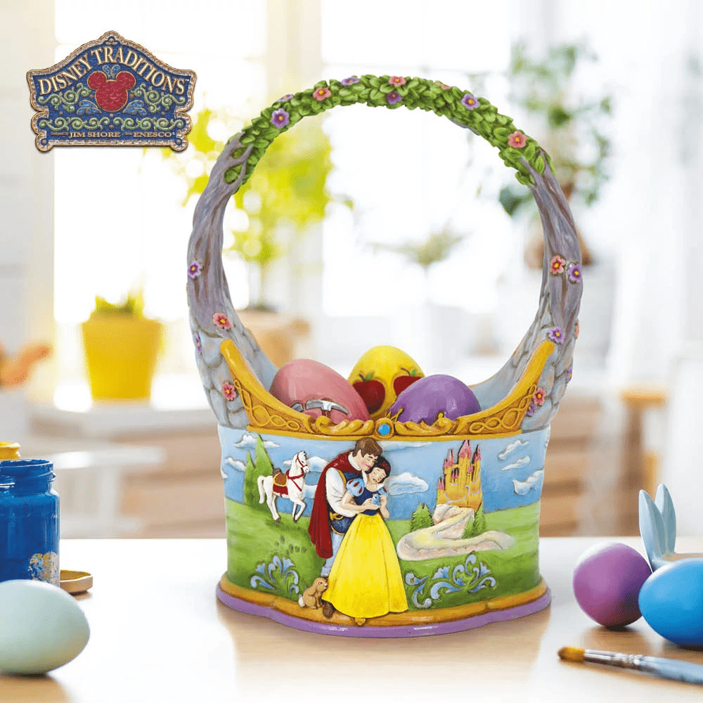 A decorative Disney-themed Easter basket with painted eggs, featuring Snow White and Prince Charming, a castle, and a horse. The basket is detailed with flowers and vines, placed on a table with paints and more eggs nearby. A decorative Disney-themed Easter basket with painted eggs, featuring Snow White and Prince Charming, a castle, and a horse. The basket is detailed with flowers and vines, placed on a table with paints and more eggs nearby.