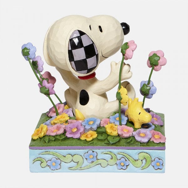 Snoopy in bed of Flowers Figurine By Jim Shore
