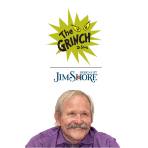 Illustration of The Grinch logo with yellow eyes above Designs by Jim Shore text, and an older man with gray hair and mustache smiling below, wearing a purple shirt.
