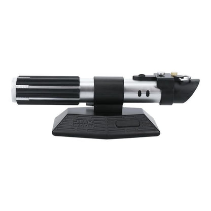 The Star Wars Lightsaber Uplighter by Paladone is an officially licensed silver and black hilt replica, inspired by Darth Vader, displayed horizontally on a black stand with the Star Wars logo embossed on the base.