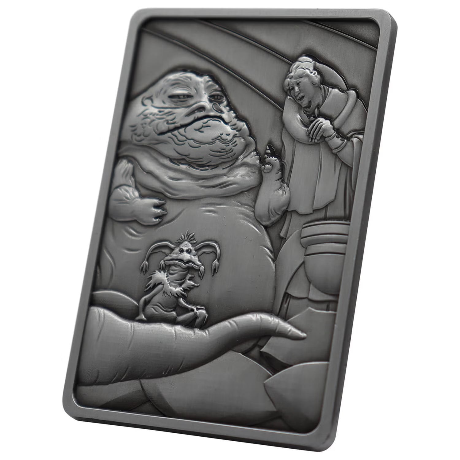The Fanattik Star Wars Jabba The Hut Metal Ingot is a limited edition rectangular silver collectible featuring raised designs of Jabba, Princess Leia in chains, and Salacious B. Crumb with detailed Star Wars backgrounds.