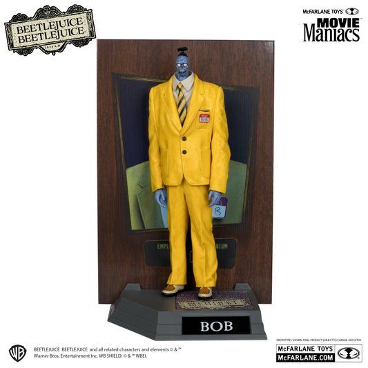 The McFarlane Toys Movie Maniacs Shrinker Bob figure features Bob in a bright yellow suit with tie on a display base with his name, plus a background board and Movie Maniacs Figures logos.