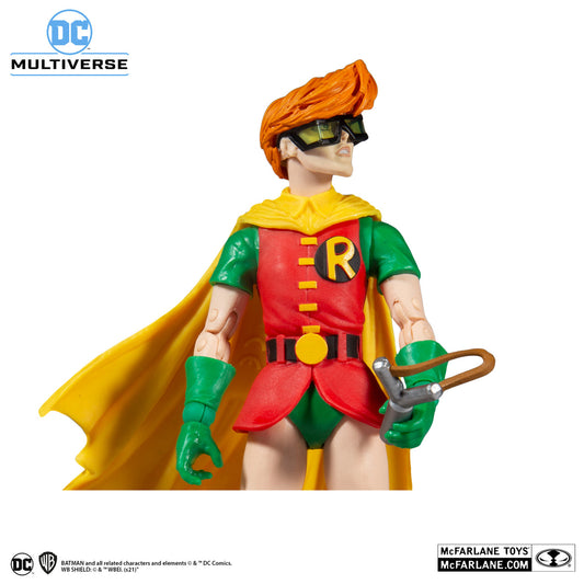 The McFarlane Toys DC Multiverse Robin Dark Knight Returns Build-A-Fig 15436 features Robin in a red, green, and yellow costume with a yellow cape, slingshot, orange hair, and green-tinted glasses—perfect for Batman fans.