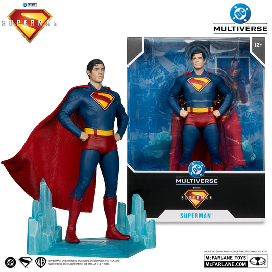 A McFarlane Toys DC Multiverse Superman 1:6th Scale Statue, inspired by the Superman movie and featuring the classic suit and cape on a crystal-like base, stands beside its boxed packaging.