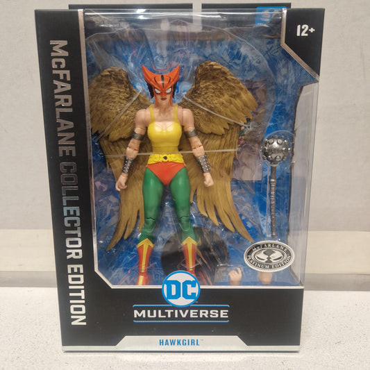 The McFarlane Toys DC Multiverse Hawkgirl Platinum Justice League Of America action figure is shown in its box, featuring Hawkgirl with wings, helmet, and mace. The packaging indicates it’s for ages 12 and up.