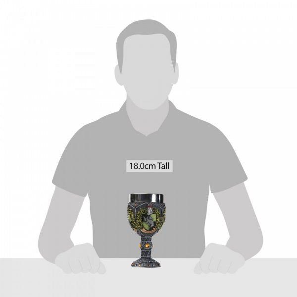 A grey silhouette sits behind the Harry Potter Hufflepuff Decorative Goblet from The Wizarding World of Harry Potter, placed on a table to show its 18.0 cm height and ornate designs reflecting Hufflepuff house pride.