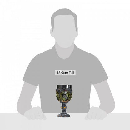 A grey silhouette sits behind the Harry Potter Hufflepuff Decorative Goblet from The Wizarding World of Harry Potter, placed on a table to show its 18.0 cm height and ornate designs reflecting Hufflepuff house pride.