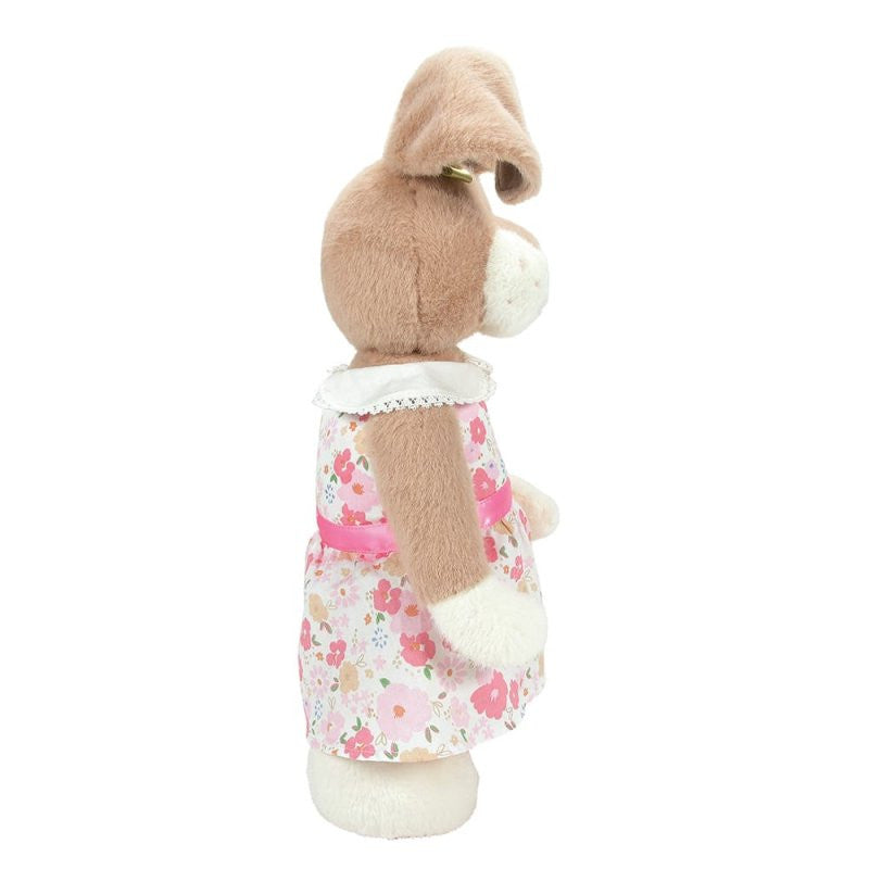 A side view of the Honey Hopplebuns 14 Inch Plush Soft Toy by Boyds Bears shows a brown and white bunny in a floral pink dress with a white lace collar, one ear bent, standing upright.