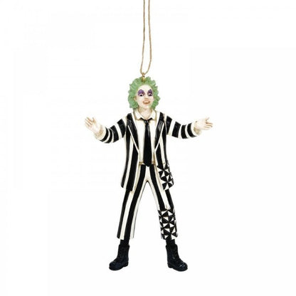 The Beetlejuice By Jim Shore Classic Beetlejuice Hanging Ornament 6016179 features the iconic character with green hair, pale face, dark eye makeup, black and white striped suit, black boots, and outstretched arms.