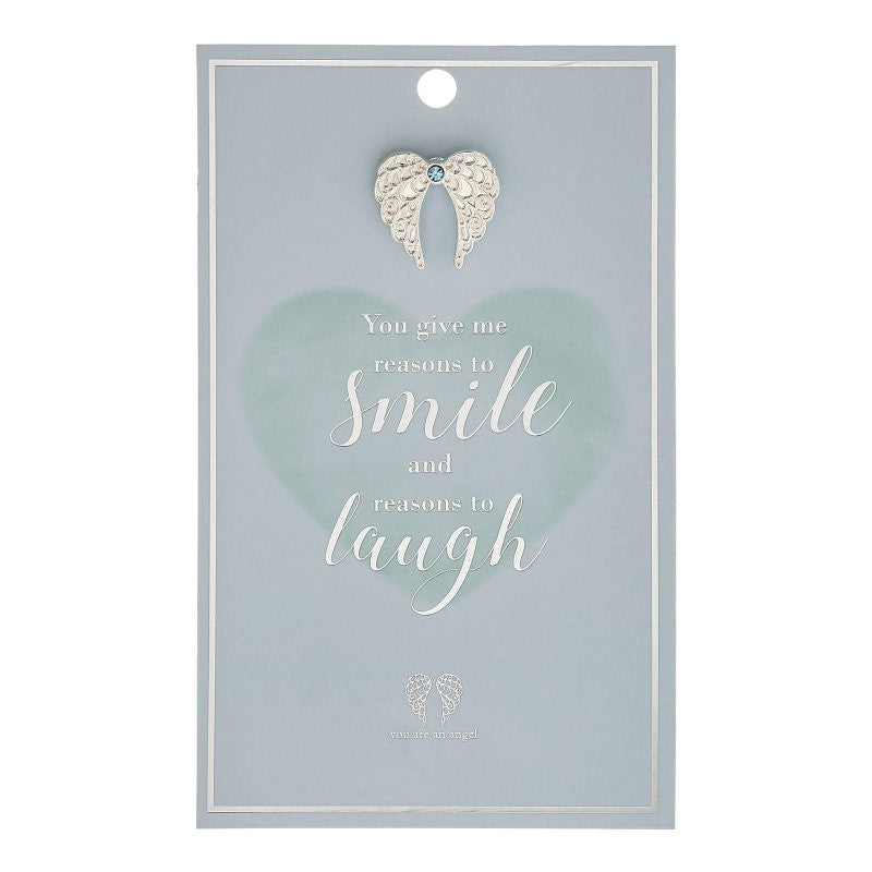 The Reasons To Smile Pin Card ANCP079 by You Are An Angel features a light blue card with a silver angel pin, heartfelt message: You give me reasons to smile and reasons to laugh, and small heart with you are an angel at the bottom.