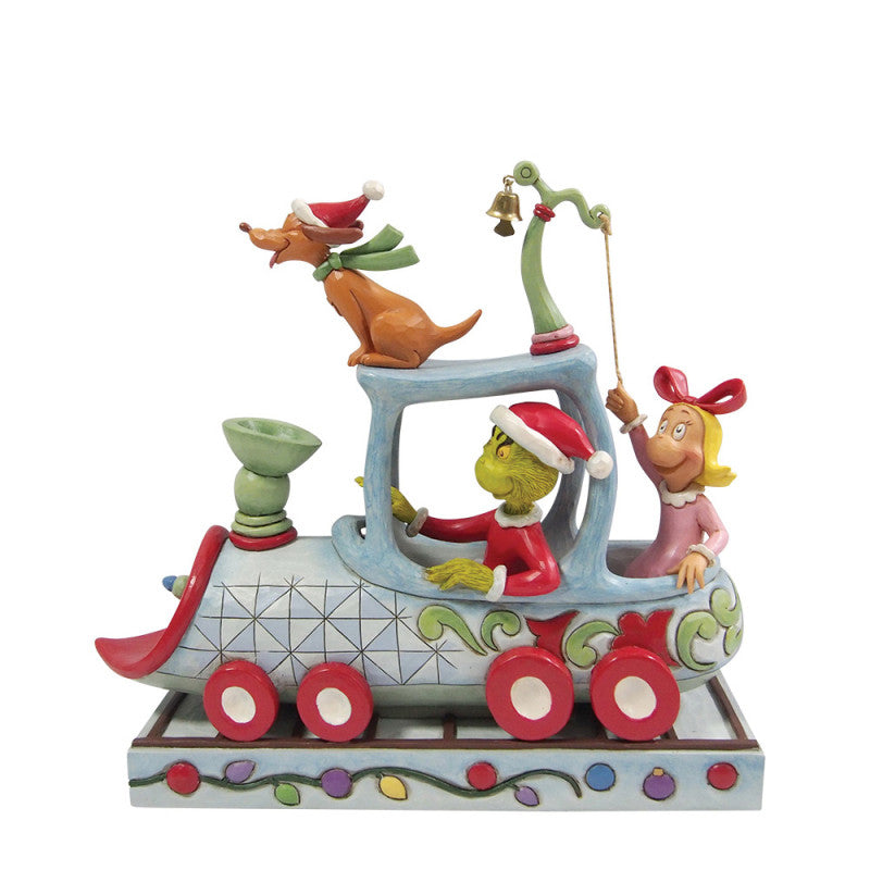 The Grinch Train Figurine By Jim Shore 6017070 from The Grinch By Jim Shore features the Grinch driving a whimsical car with red wheels, joined by Cindy Lou Who with a bell and Max in a Santa hat—perfect for holiday cheer.