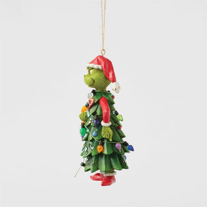 The Grinch By Jim Shore 6017078 ornament features the Grinch dressed as a Christmas tree with colorful lights and a Santa hat, hanging from a string—perfect for adding festive cheer to your holiday décor.