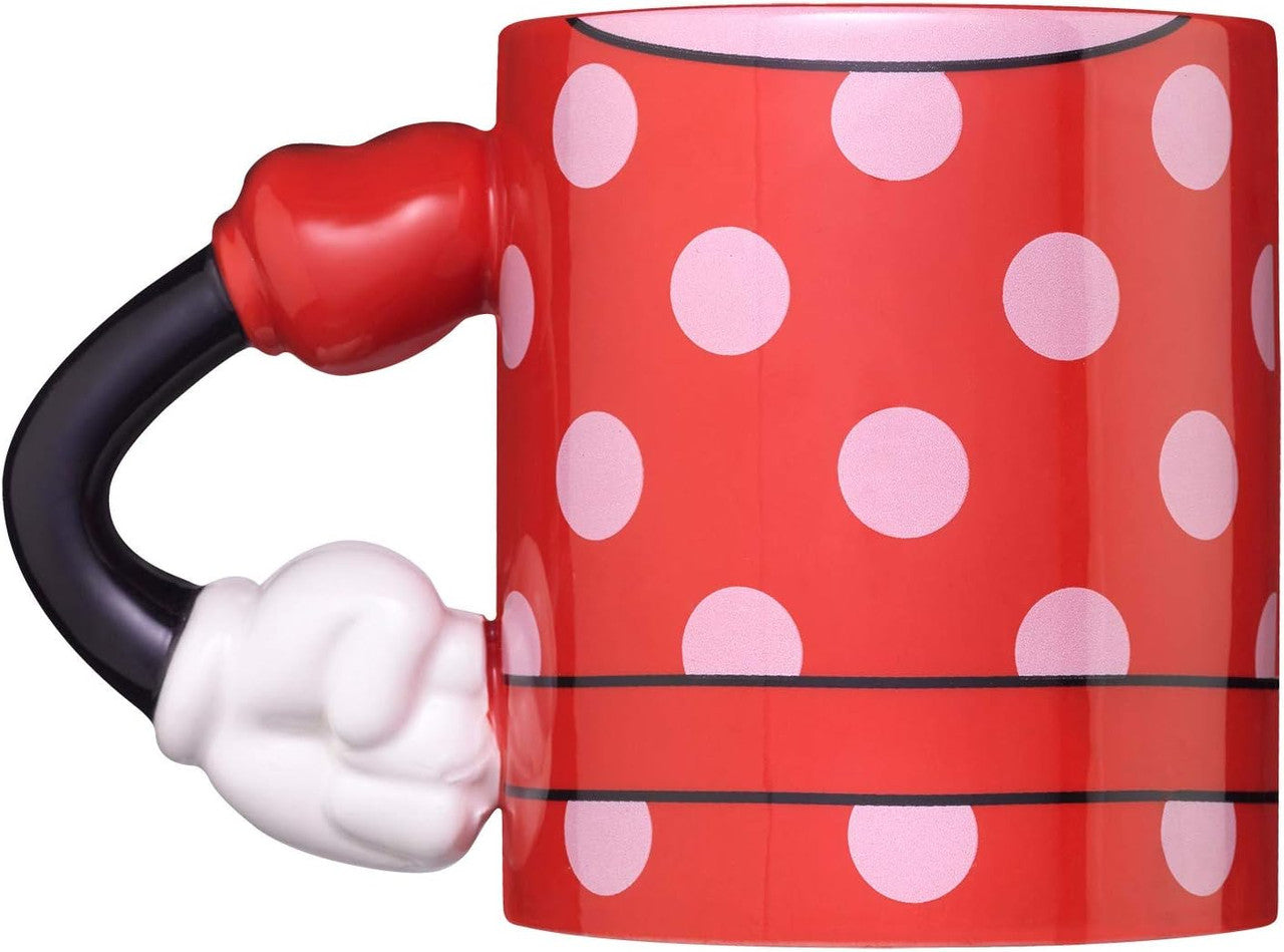 The EXG Disney Minnie Mouse Mug With 3D Arm is red with white polka dots, black accents, and a handle shaped like Minnie’s gloved hand holding a red object, inspired by the classic Disney character’s iconic outfit.