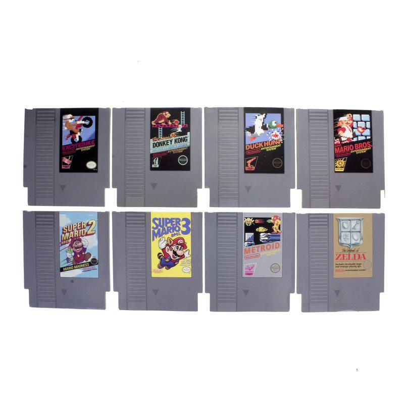 The NES Cartridge Coasters Set of 8 by Paladone features retro designs inspired by classic Nintendo Entertainment System games like Super Mario Bros., Donkey Kong, Duck Hunt, Metroid, and The Legend of Zelda.