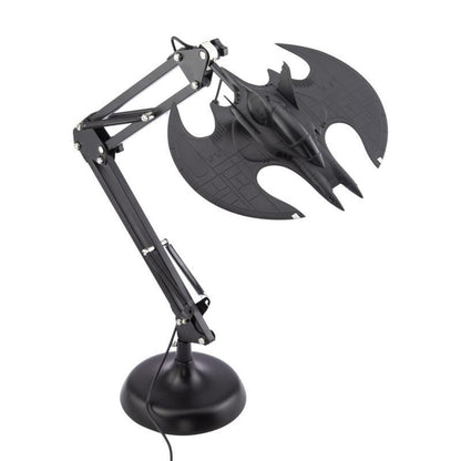 Illuminate your space with the Batman Batwing Posable Desk Light V2 by Paladone, featuring a flexible arm and a Batmobile-inspired lampshade atop a round base—perfect for any Batman fan’s home or office décor.