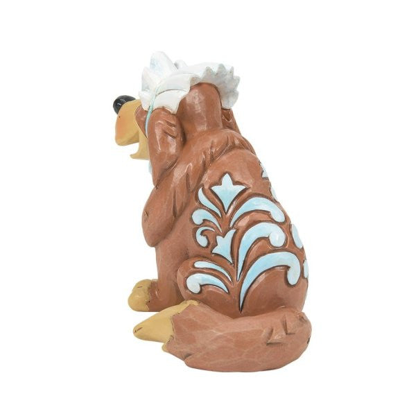The Disney Traditions Nana Mini Figurine 6014333 by Disney Traditions features brown coloring, white and light blue patterns on its back, a bushy tail, and white tufts on its head as it sits facing away.