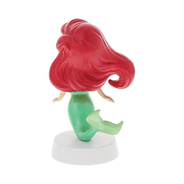 The Grand Jester Studios Disney Ariel Mini Figurine 6012012SH features the mermaid with long red hair, green tail, and pale skin, shown facing away on a round white base, perfect for collectors.