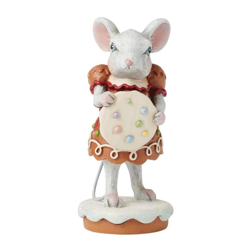 The Heartwood Creek By Jim Shore Sugar & Spice Make Christmas Nice Figurine 6017268 features a gingerbread mouse in a red and brown dress, holding a decorated cookie, standing on a white base.
