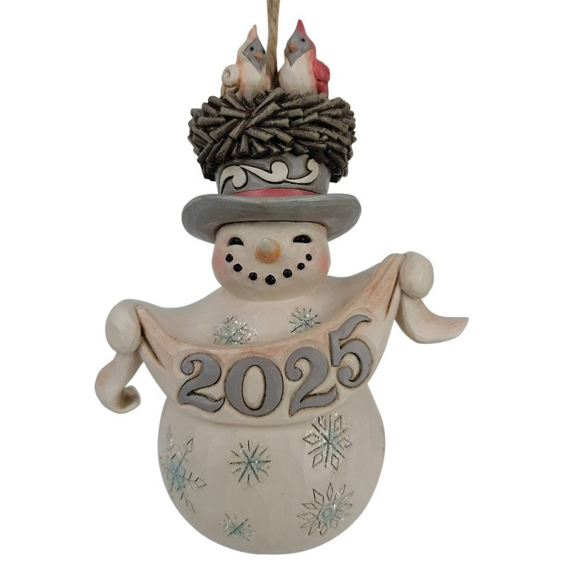 The Heartwood Creek By Jim Shore White Woodland 2025 Snowman With Hat Hanging Ornament features 2025 New Beginnings on its scarf, a nest-topped hat, red and white birds, and painted snowflakes.