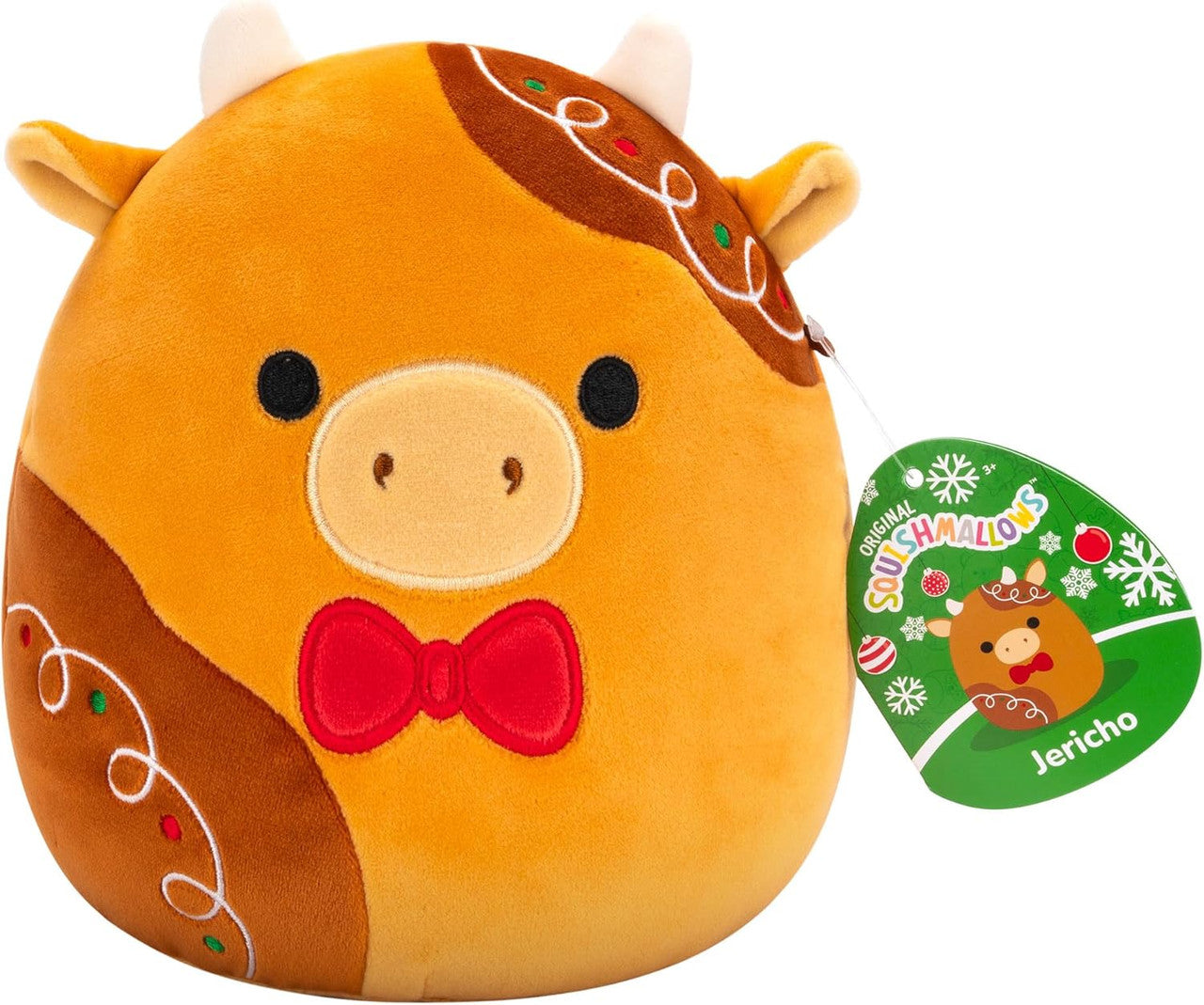 Squishmallows Jericho the Gingerbread Cow is a round collectible plush styled like gingerbread with icing details and a red bow tie, complete with a Squishmallows tag.
