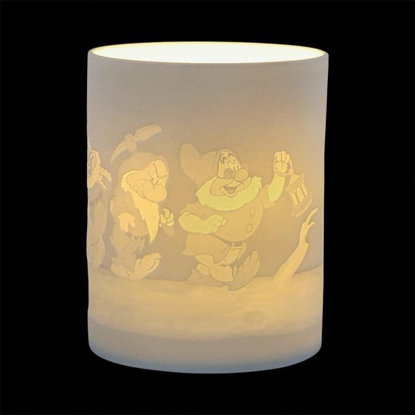 The Disney Enchanting Collection Diamond Shine (The Seven Dwarfs) Ceramic Lithophane Lamp A31088 features an etched design of the Seven Dwarfs, illuminated from within against a black background.