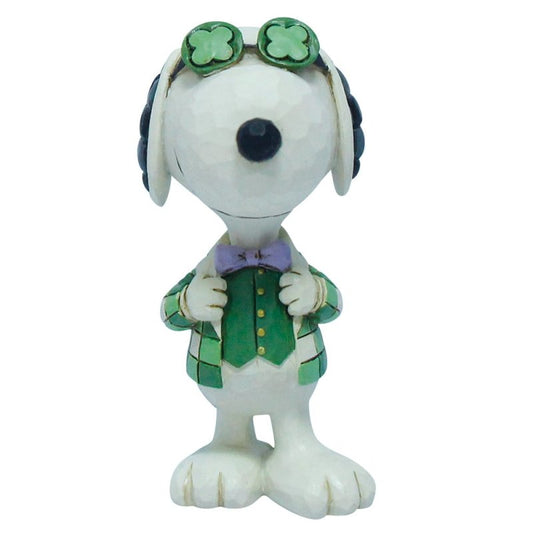 The Irish Snoopy Mini figurine by Peanuts By Jim Shore features Snoopy in a green suit, purple bow tie, and clover glasses with Jim Shore’s signature style—a delightful St. Patricks Day collectible.