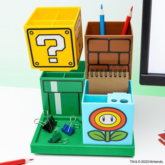 Nintendo fans will love the Super Mario Desktop Organiser by Paladone—a fun desk set featuring containers shaped like a question block, brick block, green pipe, and fire flower for storing pencils, paper clips, and notes.