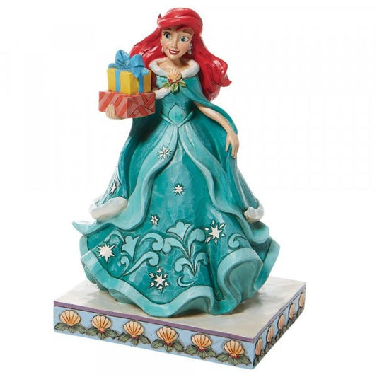 Disney Traditions Ariel (Little Mermaid) in a brilliant blue dress holding several presents figurine