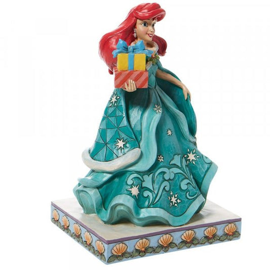 Disney Traditions Ariel (Little Mermaid) in a brilliant blue dress holding several presents figurine