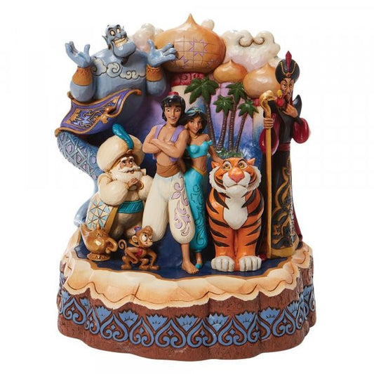 Disney Traditions Aladdin ,Jasmine take center stage as Abu, Rajah, and the Sultan smile close by. The magic carpet, lamp, Genie, and Jafar peer pointedly from the breath-taking Arabian city Carved by Heart Figurine
