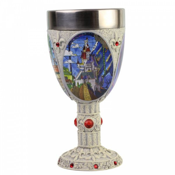 The Enesco Disney Showcase Beauty and the Beast Decorative Goblet 6007188 features a stained-glass castle, blue sky, textured stone-like stem with red gems, and metallic silver rim—an ideal addition to any Disney goblet collection.