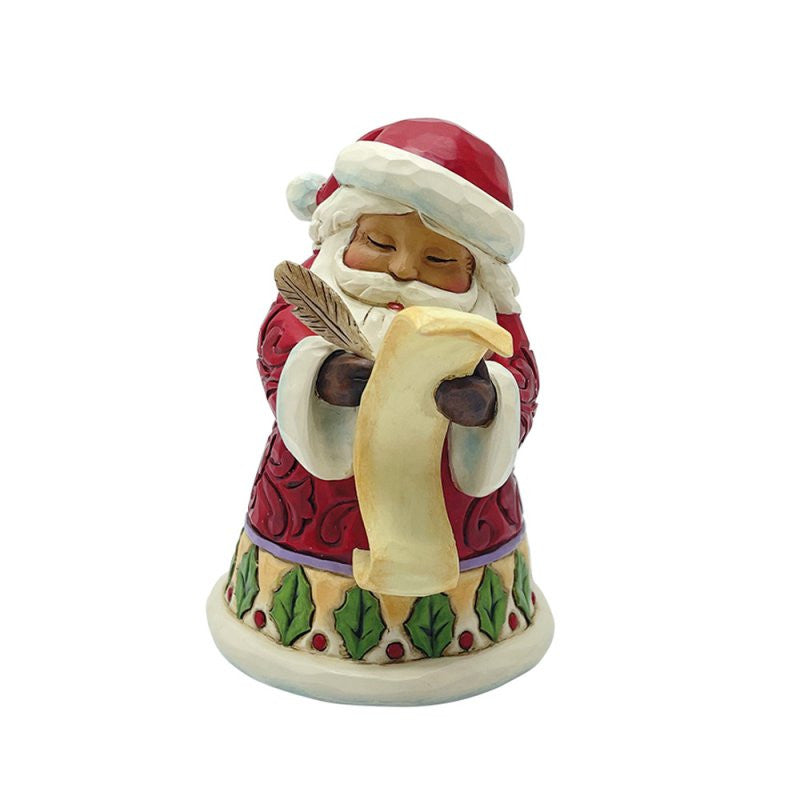 The Heartwood Creek By Jim Shore Santa With List Mini Figurine (6017275) features Santa in a red coat with green accents, holding a scroll and quill—ideal for festive holiday décor.