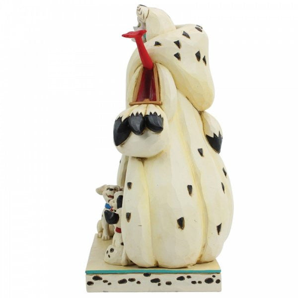 Disney Traditions Cruella de Vil with three Dalmatians under her figurine
