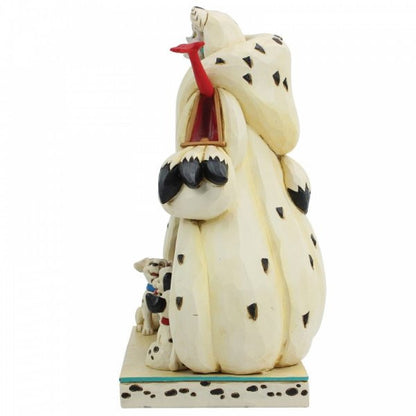 Disney Traditions Cruella de Vil with three Dalmatians under her figurine