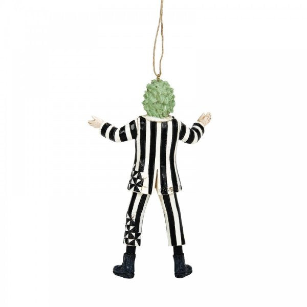 The Beetlejuice By Jim Shore Classic Hanging Ornament (6016179) features the iconic figure with green hair in a black and white striped suit and boots, arms outstretched, facing away from the viewer.