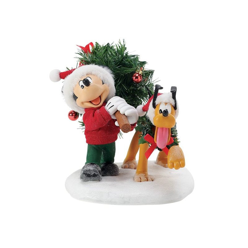 The Department 56 Disney Mickey’s Perfect Tree Possible Dreams Christmas Figurine (6015879) features a cartoon mouse in a Santa hat and sweater carrying a tree, with a happy dog in reindeer antlers on a snowy base.