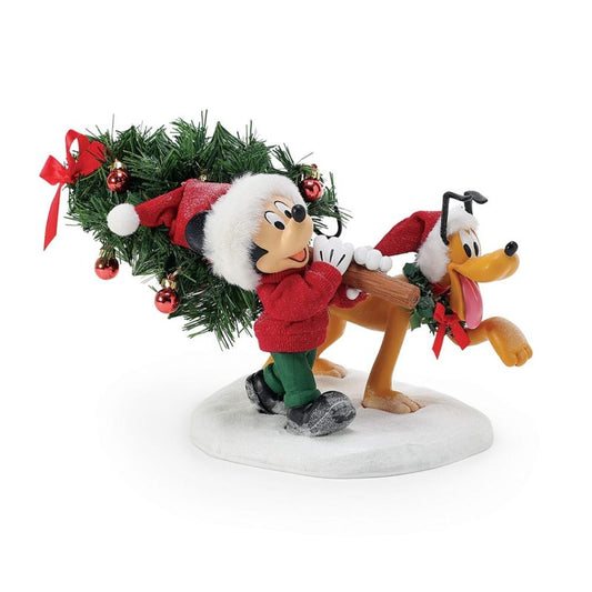 Disney Mickey’s Perfect Tree (Mickey & Minnie’s Christmas Tree) is a festive Department 56 Possible Dreams Christmas Figurine—Mickey and Minnie in Santa hats carry a decorated tree over snow. Item 6015879.