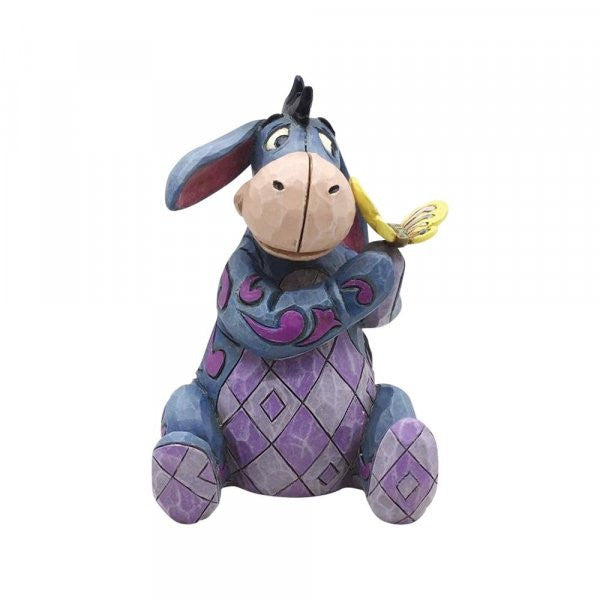 Disney Traditions Eeyore from Winnie the Pooh with a butterfly on his hand figurine