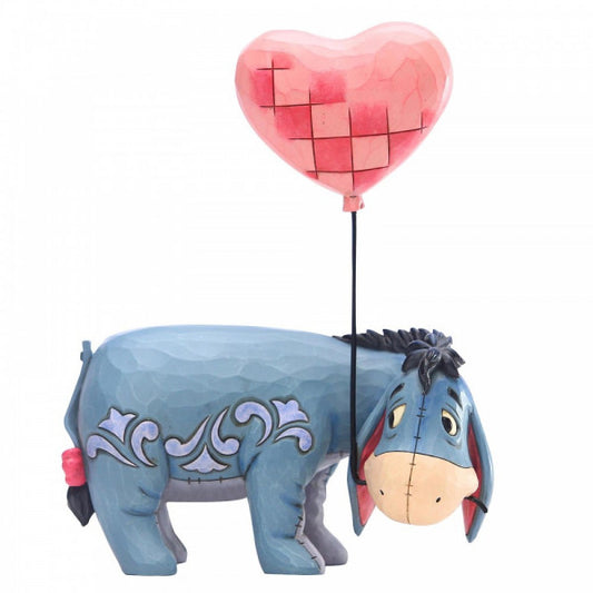 Disney Traditions Eeyore from Winnie the Pooh holding a heart shaped balloon Figurine