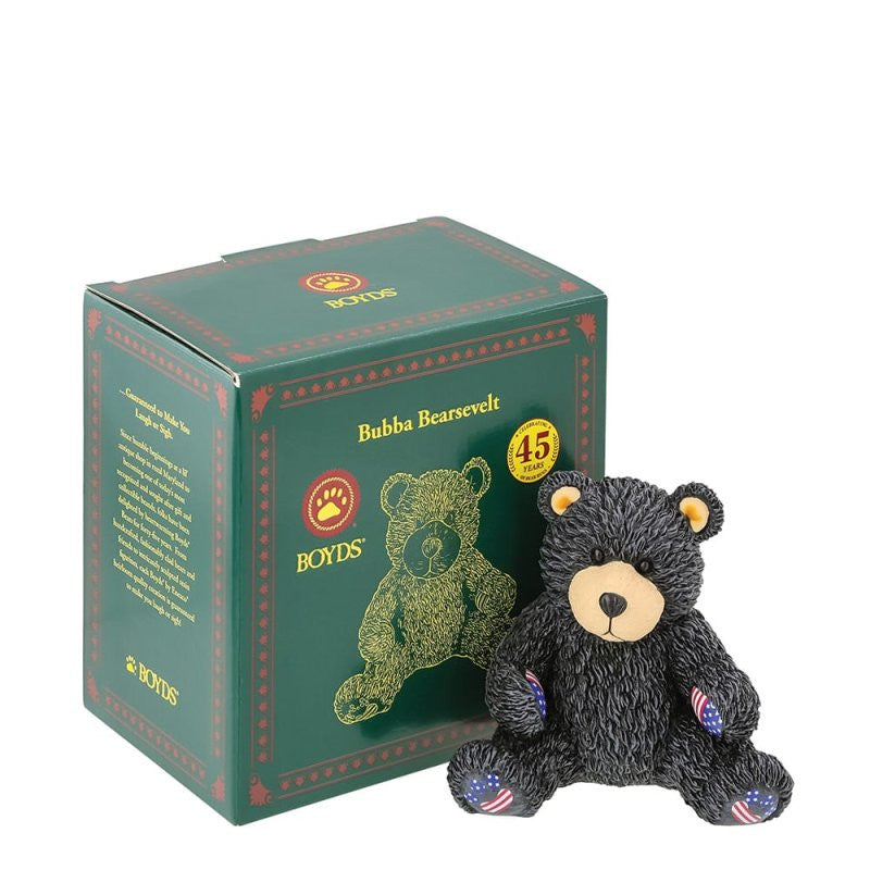 The Bubba Bearsevelt Figurine by Boyds Bears (6016928) features a black bear with USA flag patches on its feet, sitting beside a green Boyds Bears box marked for the 45th anniversary collection.