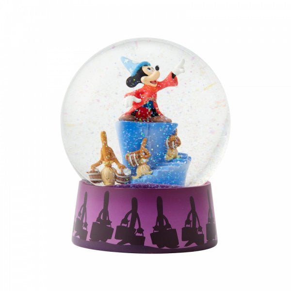 The Enesco Disney Showcase Sorcerer Mickey Fantasia Waterball (6004109) features Mickey as the Sorcerers Apprentice on blue platforms with enchanted brooms, wearing a red robe and blue hat. The purple base shows black broom silhouettes.