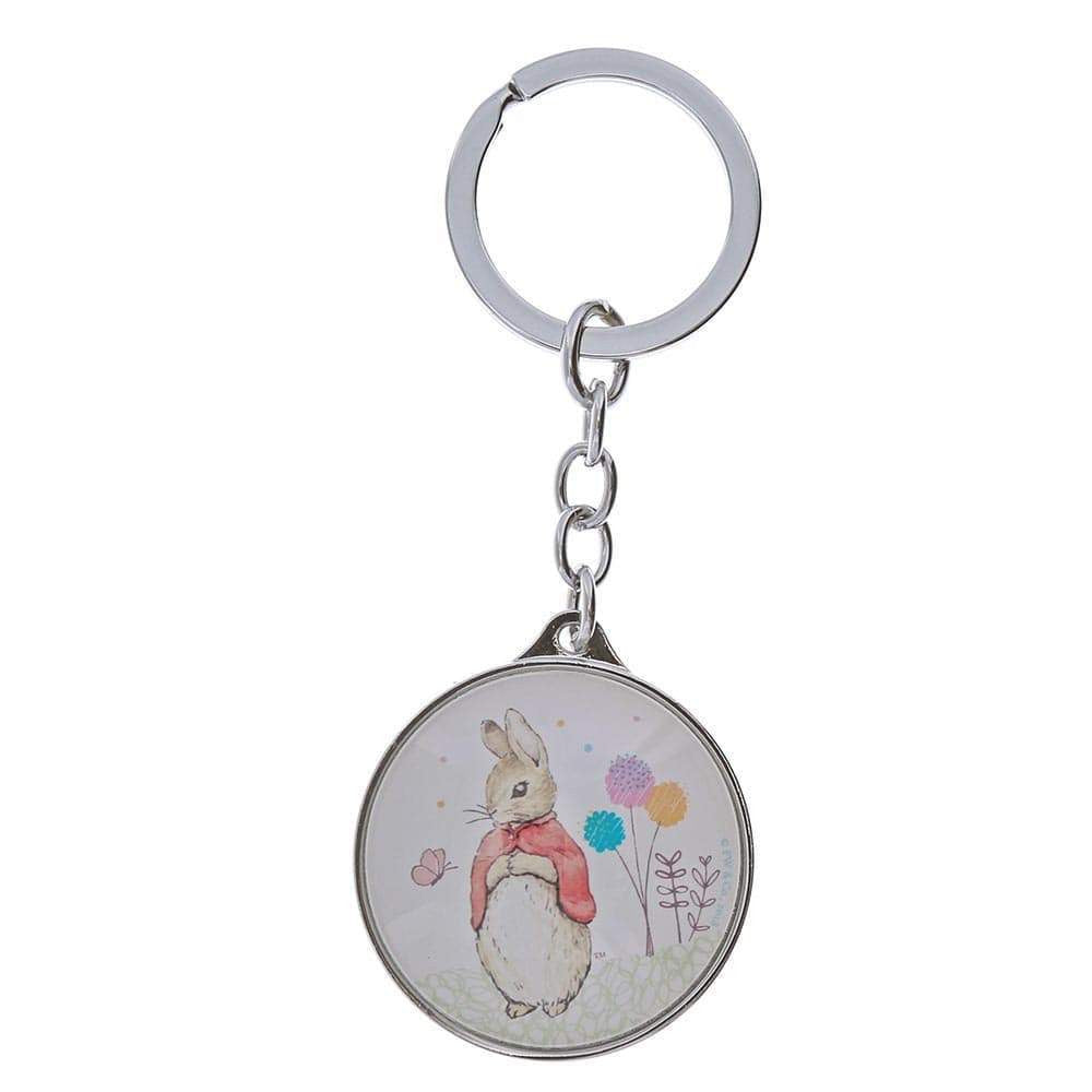 The Beatrix Potter Flopsy Bunny Keyring features a round metal design with an illustration of Flopsy Bunny in a red jacket among pastel flowers on a white background.