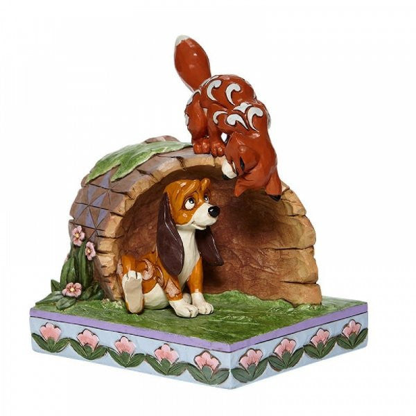 Disney Traditions Fox and Hound playing on a log figurine