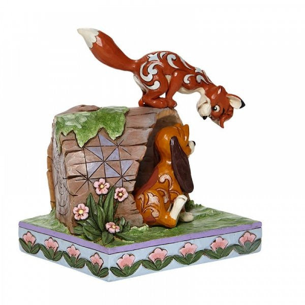 Disney Traditions Fox and Hound playing on a log figurine