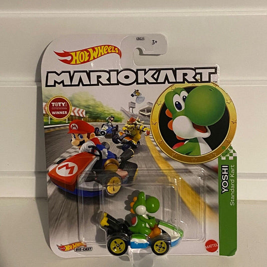 Hot Wheels Mario Kart Green Yoshi Standard Kart by Hot Wheels comes in packaging with a die-cast Yoshi car. The card features Mario, Bowser, and Yoshi racing, plus a large Yoshi image—ideal for die-cast vehicle collectors.