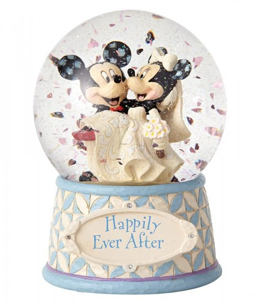 Disney Traditions Mickey carries Minnie in her wedding dress inside a waterball with a plaque which says 'Happily Ever After' on it figurine