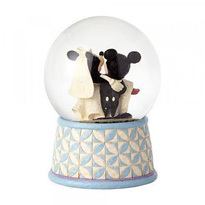 Disney Traditions Mickey carries Minnie in her wedding dress inside a waterball with a plaque which says 'Happily Ever After' on it figurine