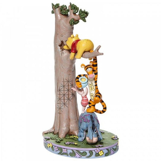 Disney Traditions Eeyore, Piglet & Tigger help Winnie the Pooh get honey from a tree Figurine