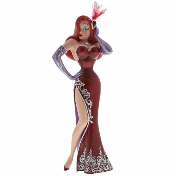 The Enesco Disney Showcase Jessica Rabbit Figurine 6002182 features Jessica in a strapless red gown with a thigh-high slit, purple gloves, and a feathered headpiece, striking a confident pose with one hand on her hip.