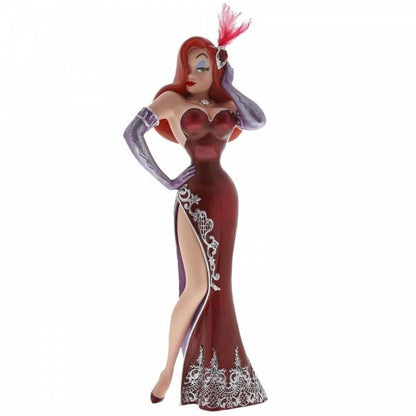 The Enesco Disney Showcase Jessica Rabbit Figurine 6002182 features Jessica in a strapless red gown with a thigh-high slit, purple gloves, and a feathered headpiece, striking a confident pose with one hand on her hip.
